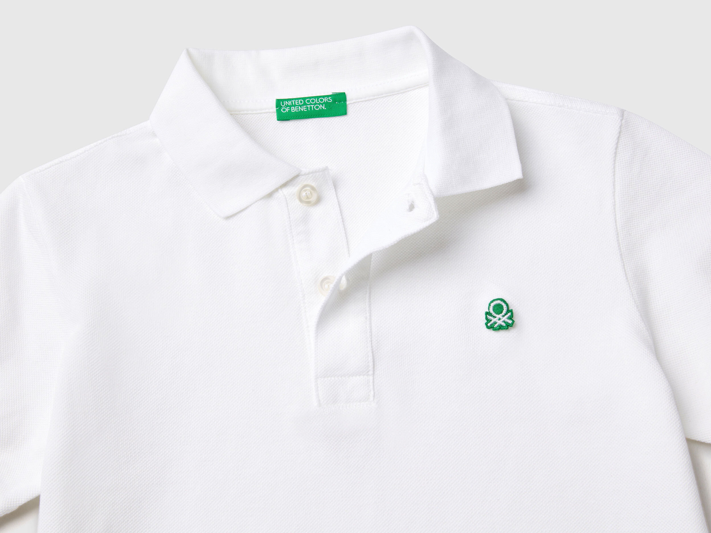 Slim fit polo in 100 organic cotton White Benetton