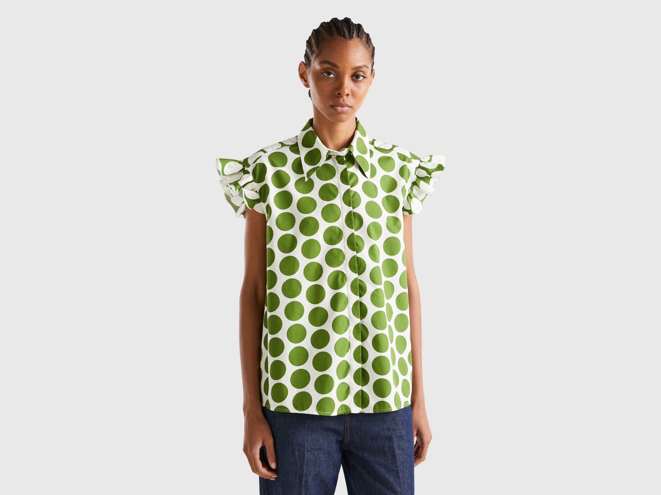 Green and white polka dot shop shirt