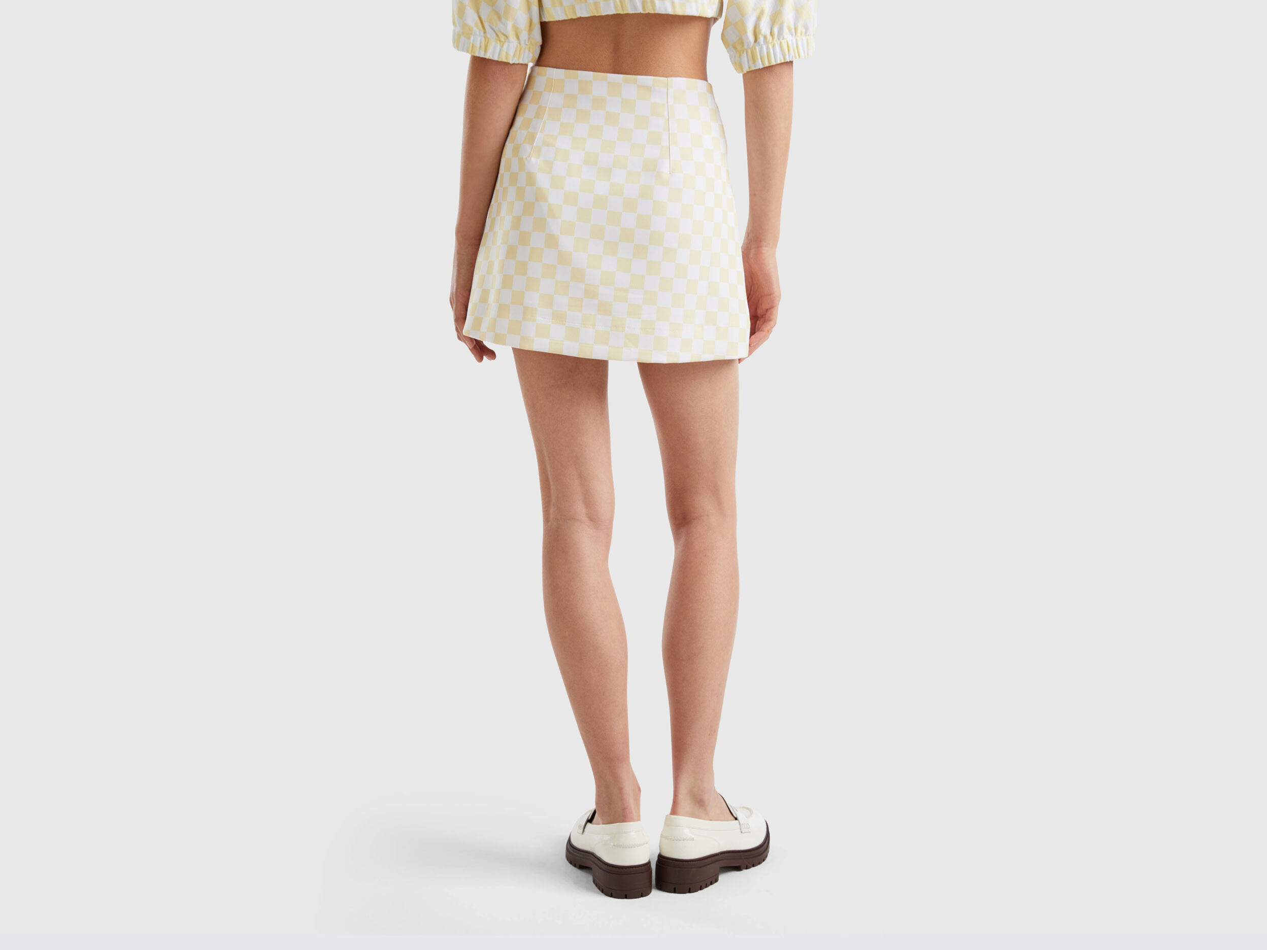 White and yellow mini skirt sales