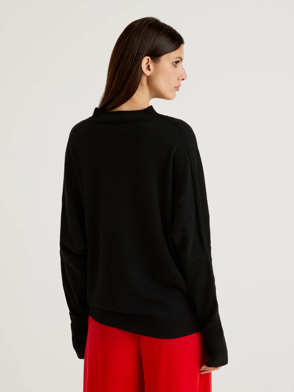 Black turtleneck with ribbed sleeves