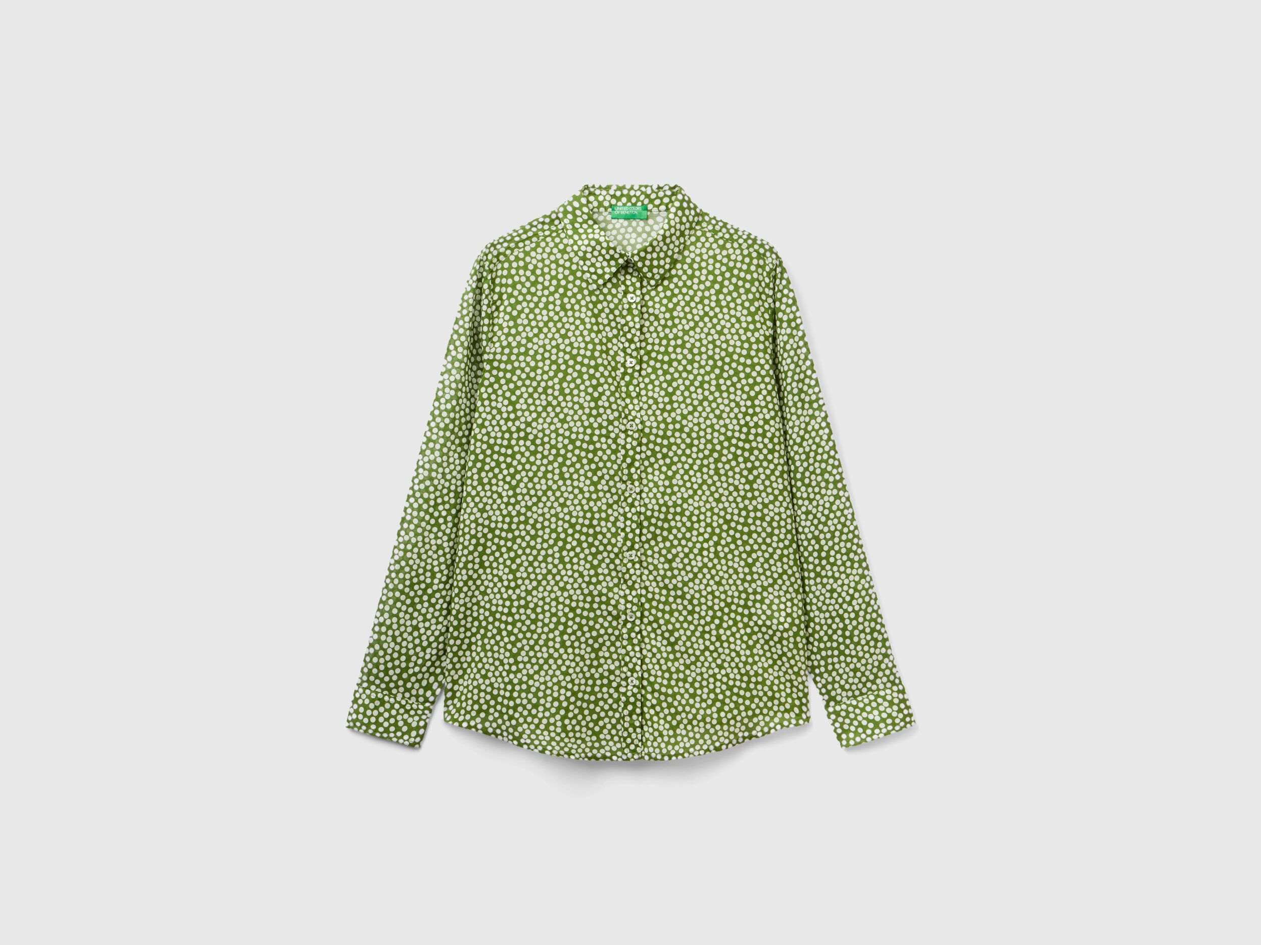 Green and white polka dot top shop