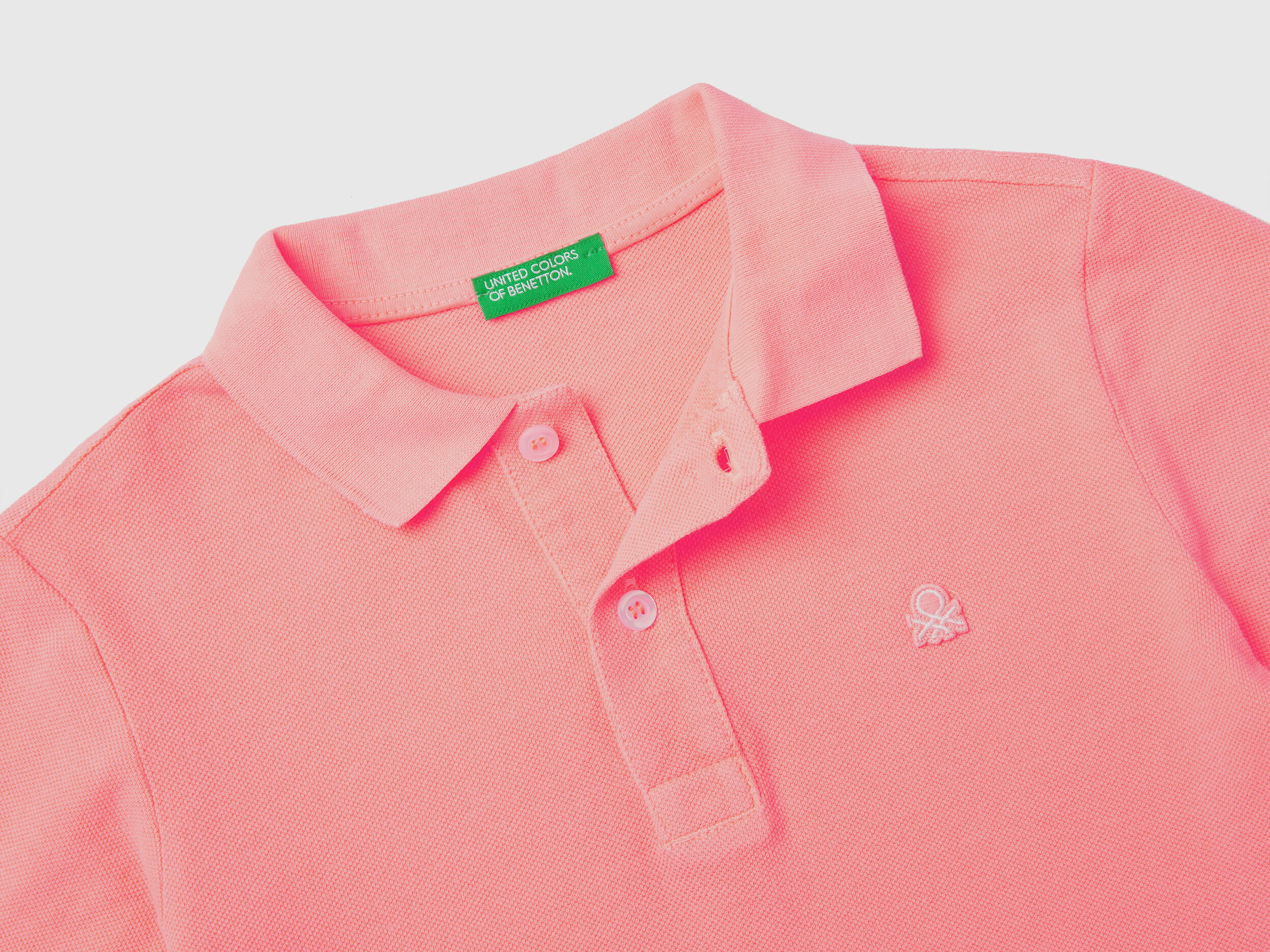 Neon pink polo shirt on sale