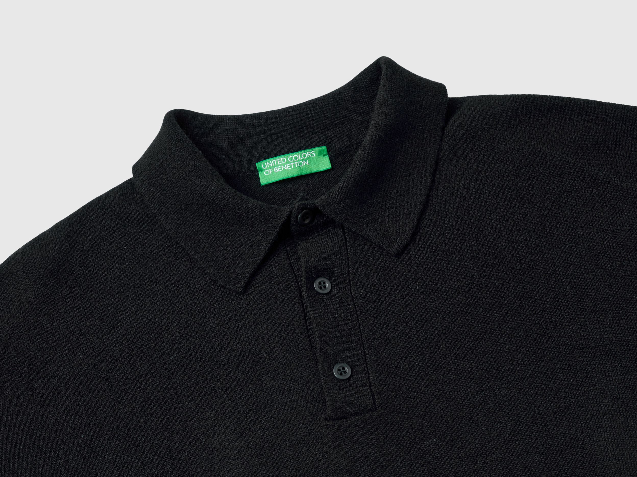 Black polo in pure Merino wool