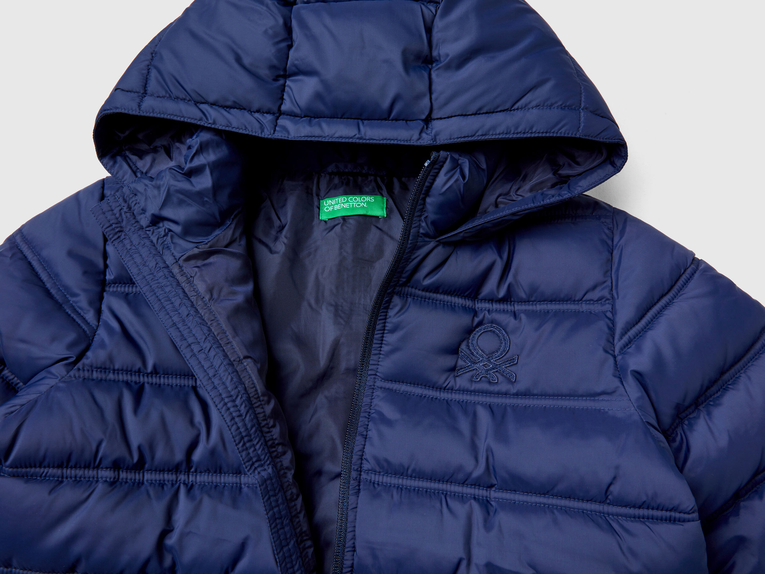 Puffer jacket with hood and logo