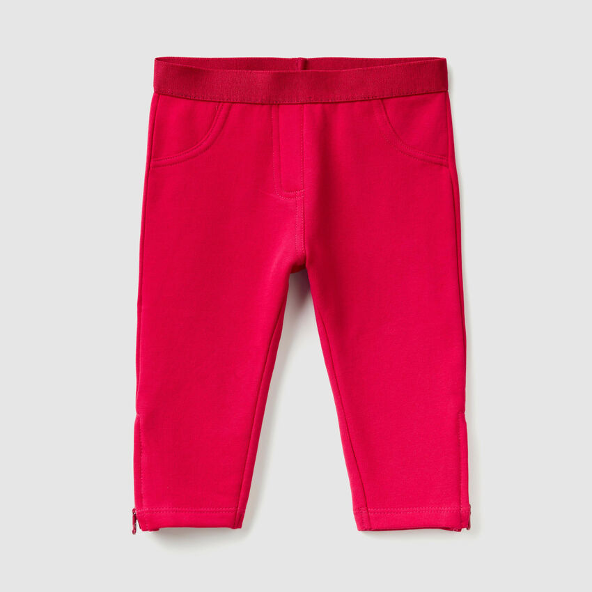 Trousers with zip at bottom