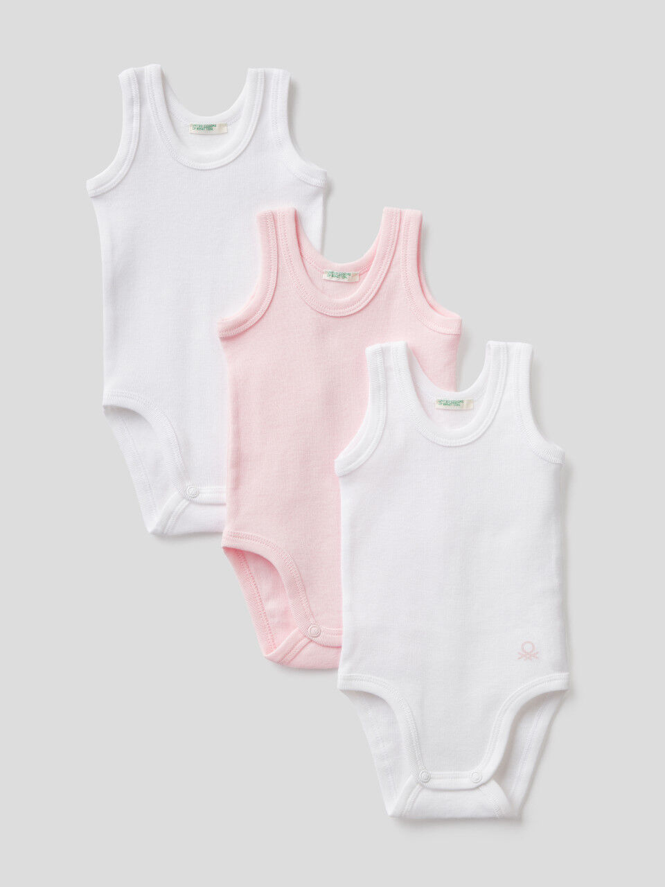 Three tank top bodysuits in solid color