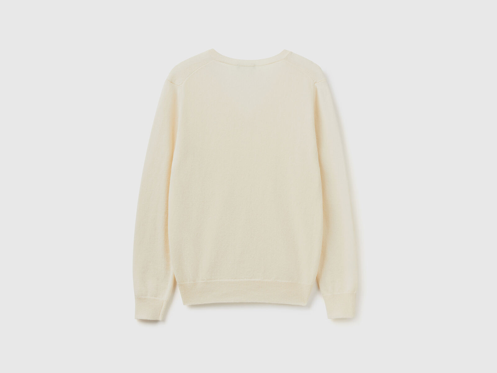Cream V-neck sweater in pure Merino wool - Creamy White | Benetton