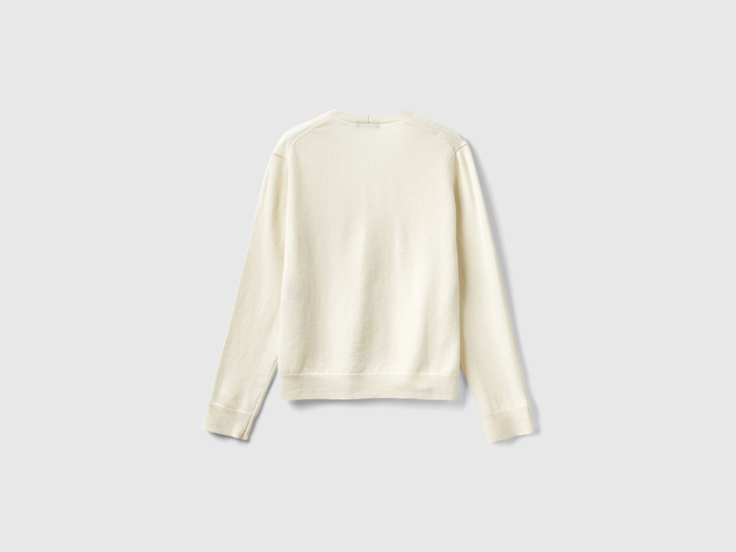 Creamy white V neck cardigan in pure Merino wool