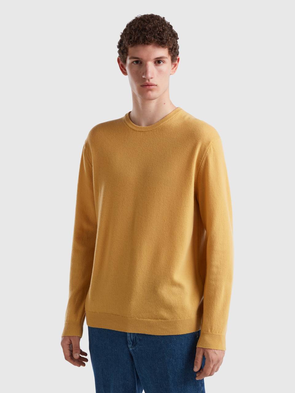 Benetton ocher yellow crew neck sweater in pure merino wool. 1