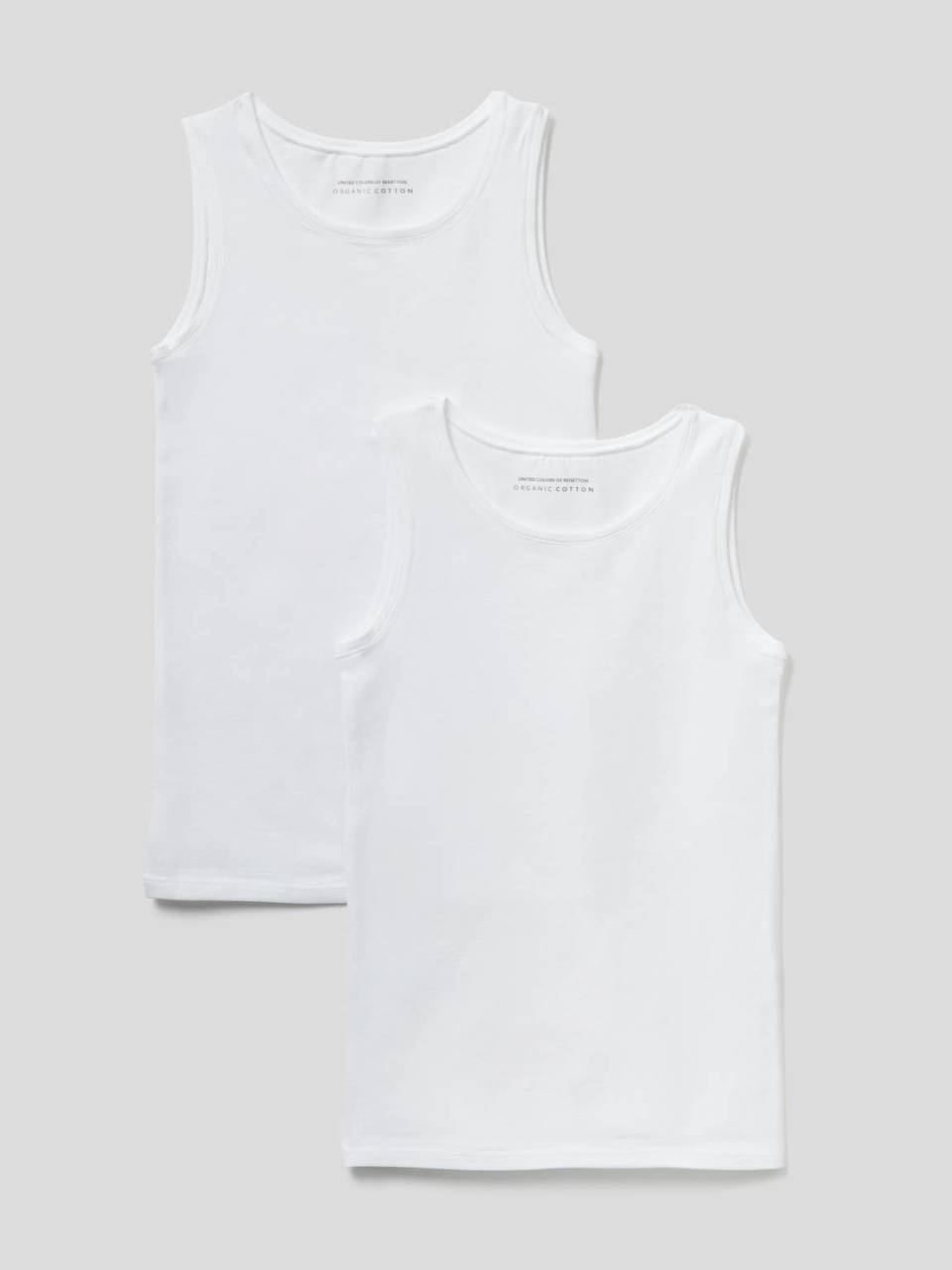 Benetton Two tank tops in super stretch organic cotton. 1